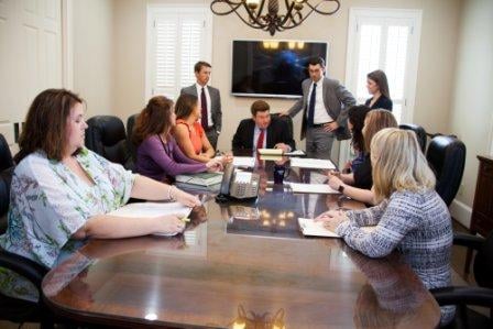 attorneys and staff meeting in conference room for personal injury case | Law Offices of Gary Bruce