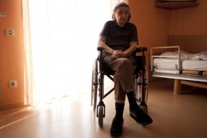 Sad elderly person in wheelchair | Nursing home abuse lawyer | Law Offices of Gary Bruce