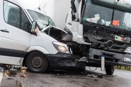 collision between van and semi truck